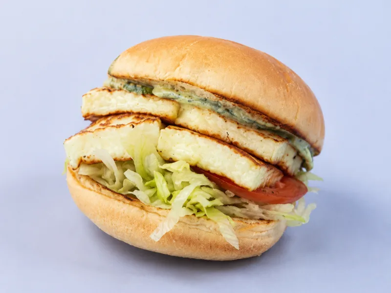 Halloumi burger with lettuce, onion, tomato and cucumber
